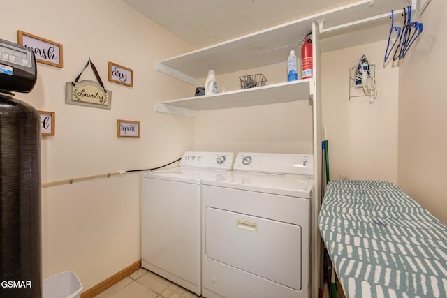 1315 Mccarter Hollow Rd, Sevierville, TN 37862 - washroom with washer and clothes dryer and light tile patterned flooring