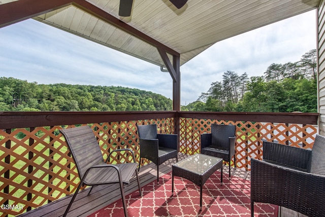1315 Mccarter Hollow Rd, Sevierville, TN 37862 - deck with ceiling fan and a wooded view