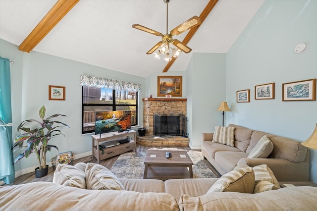 living room featuring a stone fireplace, ceiling fan, lofted ceiling with beams, and wood-type flooring