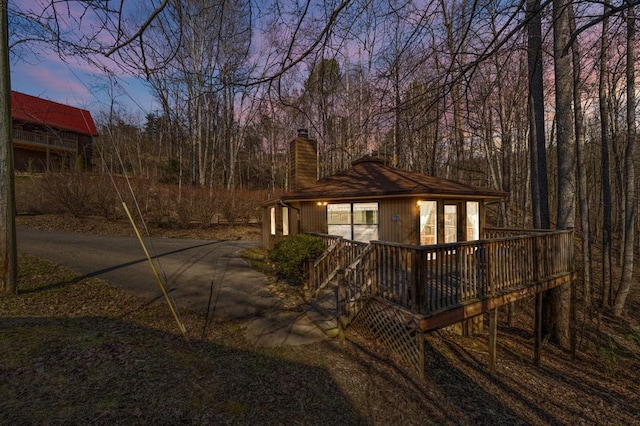 yard at dusk with a deck