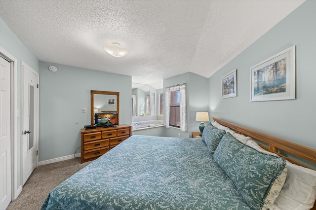 carpeted bedroom featuring a textured ceiling