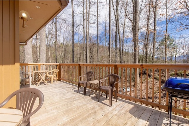 wooden terrace featuring grilling area