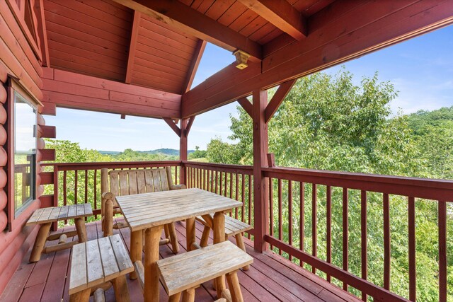 wooden deck with outdoor dining area