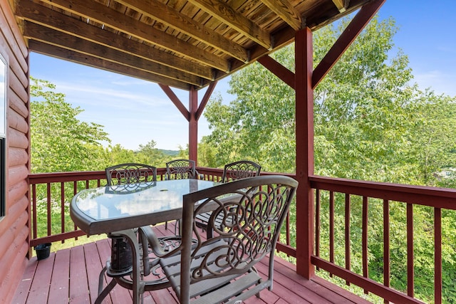 deck with outdoor dining space