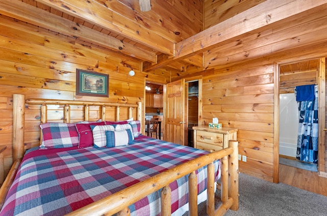 carpeted bedroom with wood ceiling, wood walls, and beam ceiling