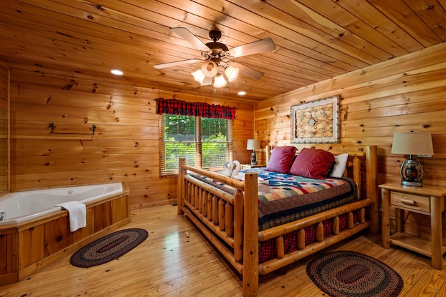 bedroom with light wood-type flooring, ceiling fan, wood walls, and wood ceiling