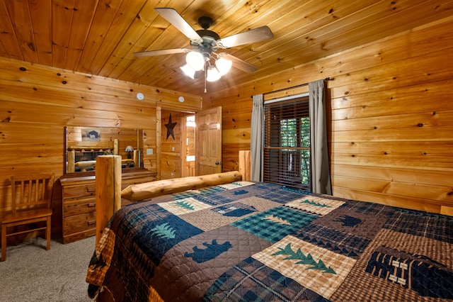 carpeted bedroom with ceiling fan, wood walls, and wood ceiling