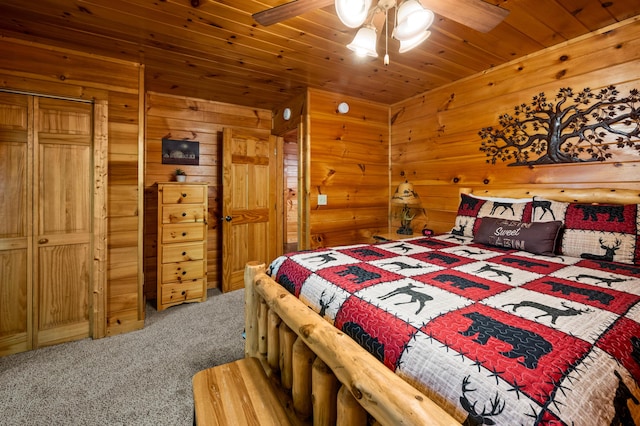 bedroom featuring carpet flooring, ceiling fan, and wood ceiling