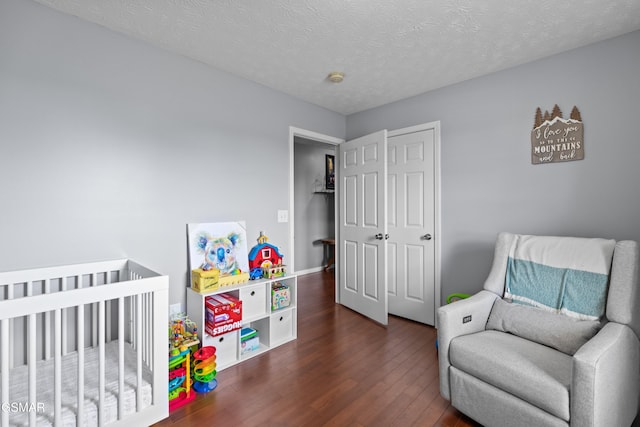 923 Red Oak Ln, Dandridge, TN 37725 - bedroom with dark wood-style flooring and a textured ceiling