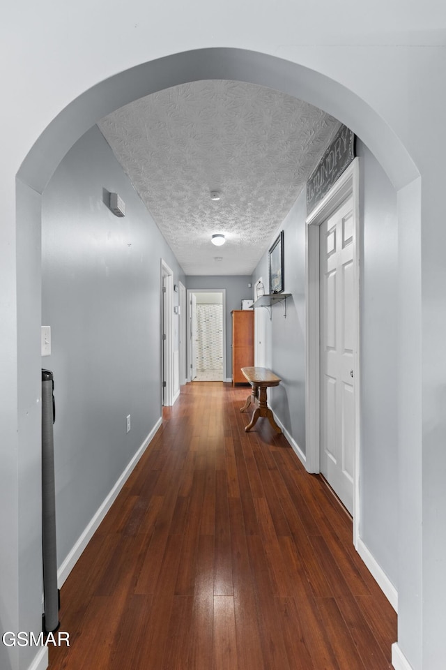 923 Red Oak Ln, Dandridge, TN 37725 - hallway with hardwood / wood-style flooring, a textured ceiling, and arched walkways