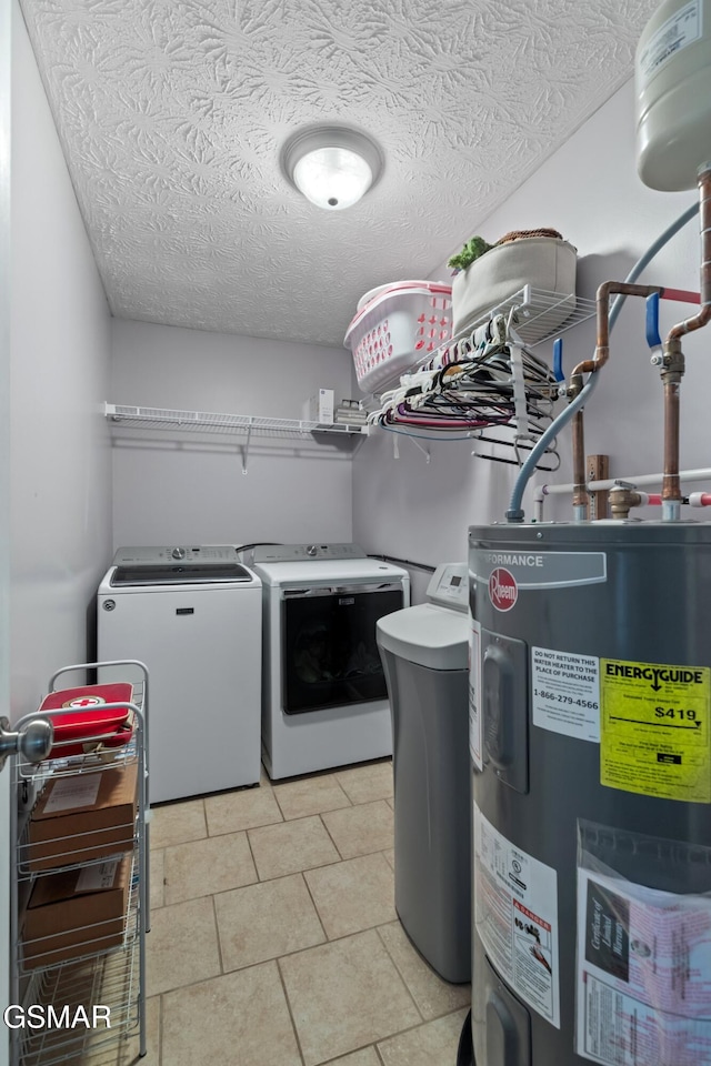 923 Red Oak Ln, Dandridge, TN 37725 - laundry room with electric water heater, washer and clothes dryer, a textured ceiling, and light tile patterned floors