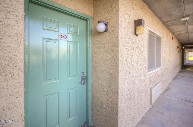 3215 N River Rd Unit 103, Pigeon Forge, TN 37863 - view of exterior entry with stucco siding