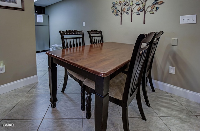 3215 N River Rd Unit 103, Pigeon Forge, TN 37863 - dining area featuring baseboards, light tile patterned floors, and a chandelier