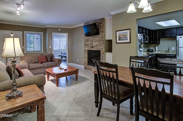 3215 N River Rd Unit 103, Pigeon Forge, TN 37863 - living room featuring ornamental molding, a fireplace, and light tile patterned flooring