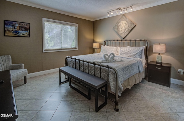 3215 N River Rd Unit 103, Pigeon Forge, TN 37863 - bedroom featuring crown molding, a textured ceiling, baseboards, and light tile patterned floors