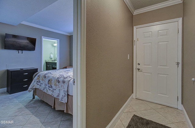 3215 N River Rd Unit 103, Pigeon Forge, TN 37863 - bedroom with ornamental molding, light tile patterned floors, baseboards, ensuite bathroom, and a textured wall