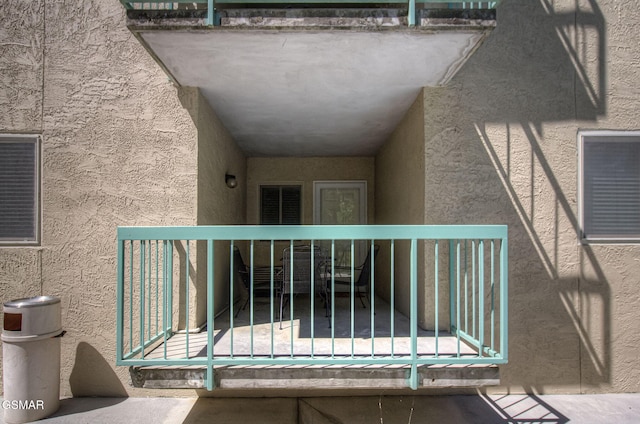 3215 N River Rd Unit 103, Pigeon Forge, TN 37863 - doorway to property with stucco siding and a balcony