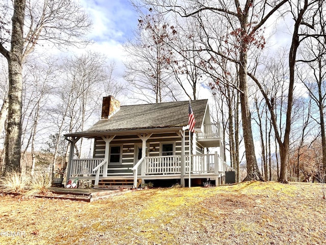 view of front of home with central air condition unit and covered porch