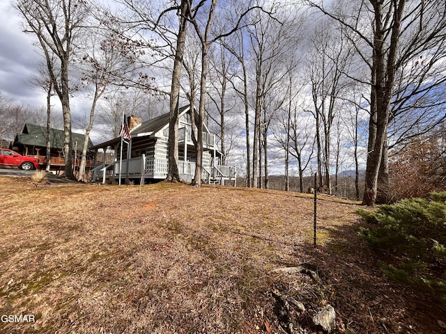 view of yard with a wooden deck