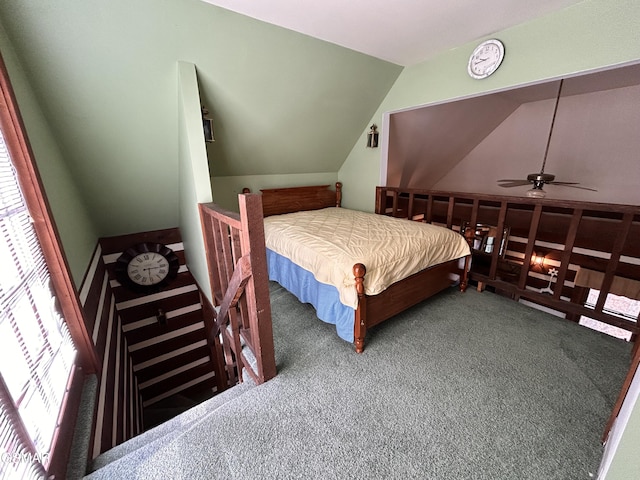 bedroom with carpet flooring, ceiling fan, and lofted ceiling