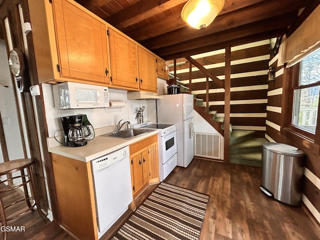 kitchen featuring white appliances, dark wood-type flooring, sink, beamed ceiling, and wood ceiling