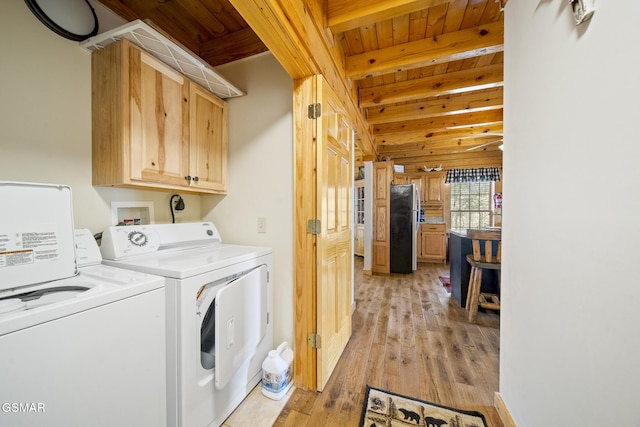 laundry area featuring wooden ceiling, cabinet space, independent washer and dryer, and light wood finished floors