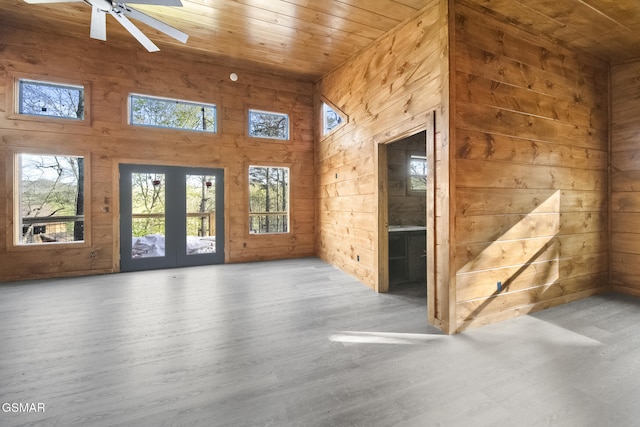 2672 Sulphur Springs Way, Sevierville, TN 37862 - spare room with wooden ceiling, wooden walls, a high ceiling, wood finished floors, and healthy amount of natural light