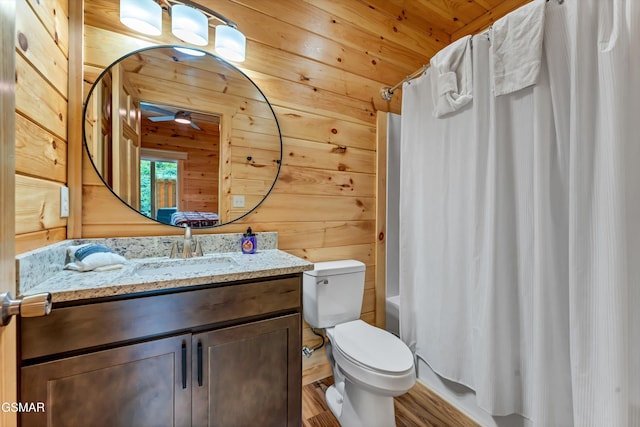 1014 Pinyon Cir, Pigeon Forge, TN 37863 - full bathroom with vanity, shower / tub combo with curtain, ceiling fan, wooden walls, and wood finished floors