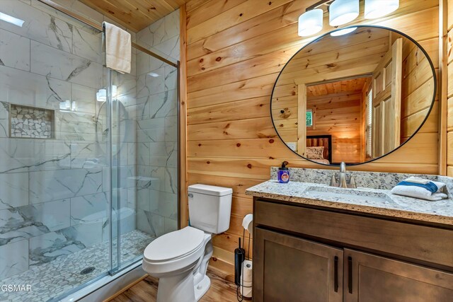 1014 Pinyon Cir, Pigeon Forge, TN 37863 - bathroom with vanity, a stall shower, wooden walls, wood finished floors, and wooden ceiling