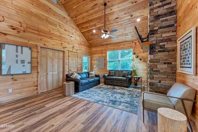 1014 Pinyon Cir, Pigeon Forge, TN 37863 - living area featuring wood walls, wood finished floors, a ceiling fan, wooden ceiling, and high vaulted ceiling