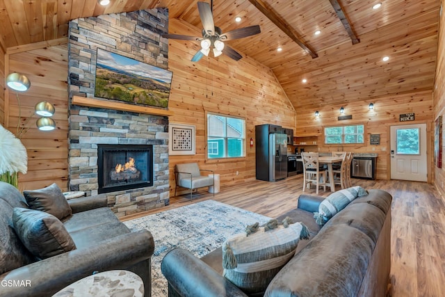 1014 Pinyon Cir, Pigeon Forge, TN 37863 - living area with a wood ceiling with exposed beams, wooden walls, high vaulted ceiling, light wood-style flooring, and a ceiling fan
