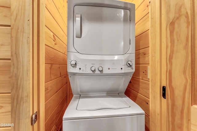 1014 Pinyon Cir, Pigeon Forge, TN 37863 - washroom with stacked washer / dryer and wooden walls