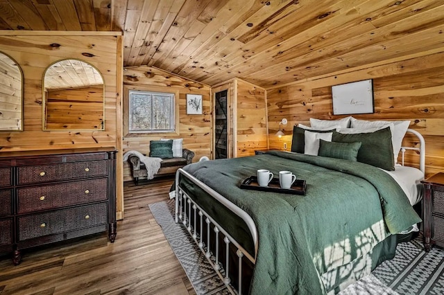 bedroom featuring lofted ceiling, wood-type flooring, wood ceiling, and wooden walls