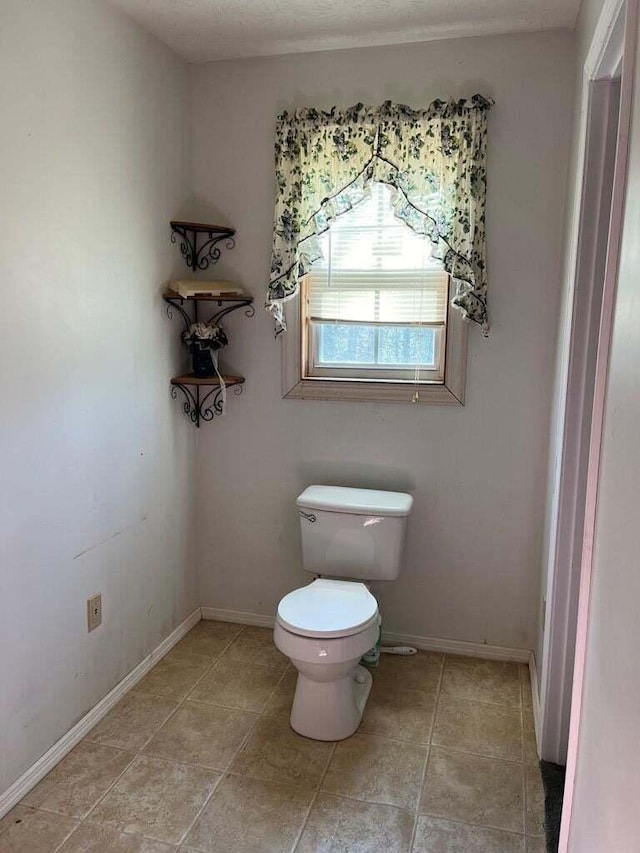 bathroom featuring toilet