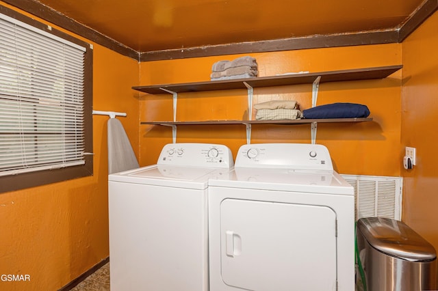 laundry room featuring carpet and washing machine and dryer