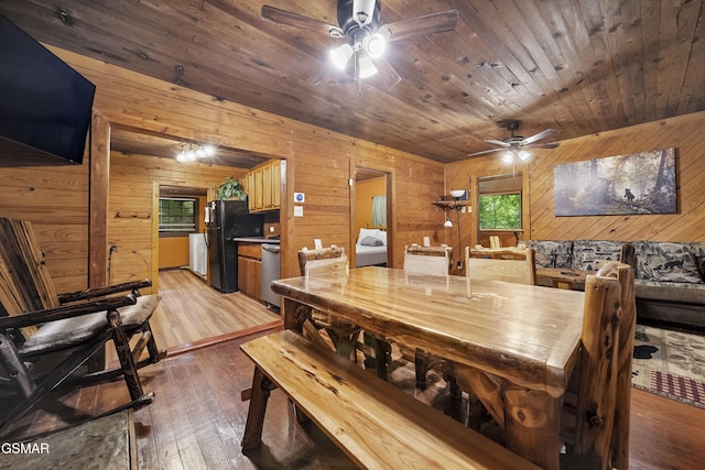 215 Lovers Ln, Townsend, TN 37882 - dining area featuring ceiling fan, wood walls, light wood finished floors, and wood ceiling