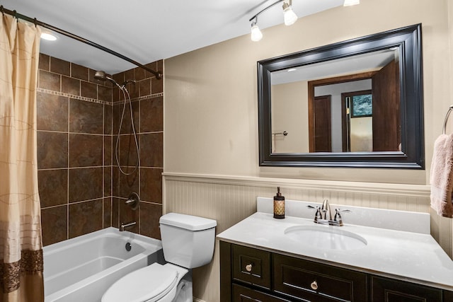 full bathroom with shower / bath combo with shower curtain, vanity, and toilet