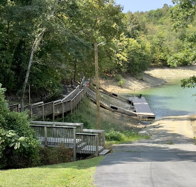 view of dock featuring a deck with water view