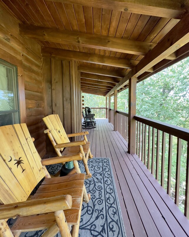 wooden terrace featuring covered porch