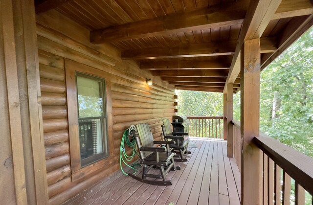 wooden terrace featuring covered porch