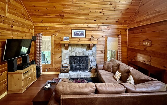 living room with wood walls, hardwood / wood-style floors, wood ceiling, and lofted ceiling