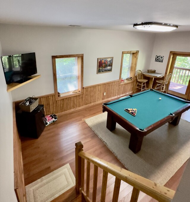 game room featuring plenty of natural light, pool table, and light hardwood / wood-style flooring