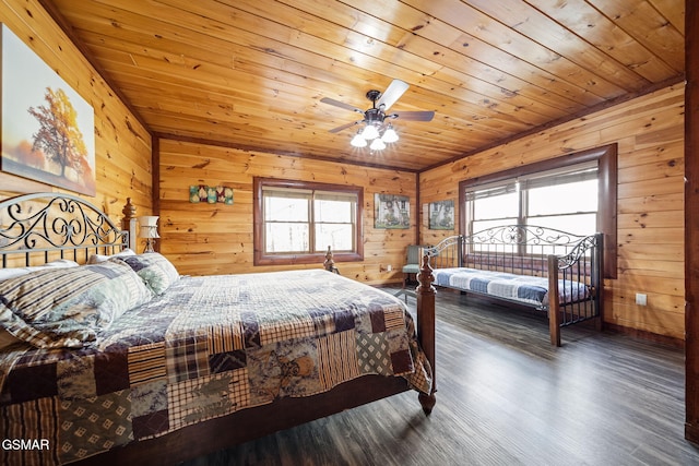 bedroom featuring dark hardwood / wood-style flooring, wooden ceiling, multiple windows, and ceiling fan