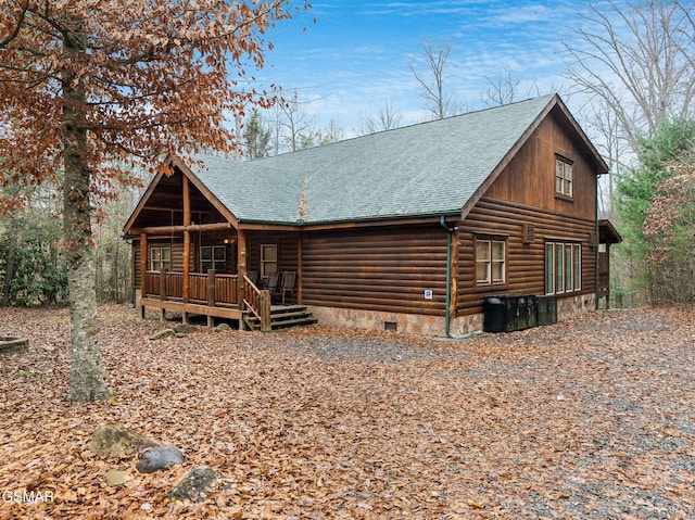 cabin featuring covered porch