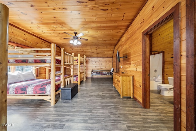 unfurnished bedroom featuring wood ceiling, ensuite bathroom, vaulted ceiling, and dark hardwood / wood-style floors