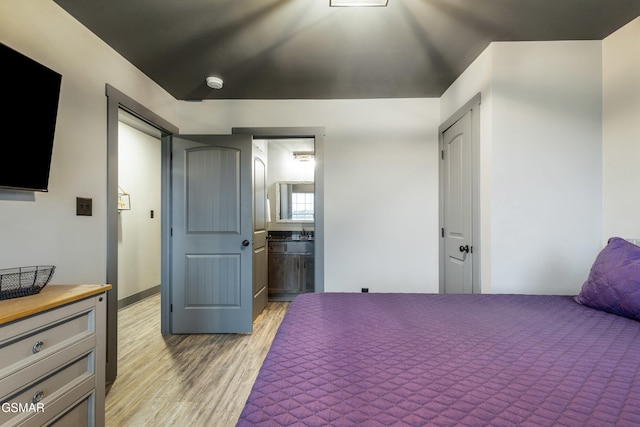 970 Douglas Dam Rd Unit 6, Kodak, TN 37764 - bedroom featuring light wood-type flooring and ensuite bathroom
