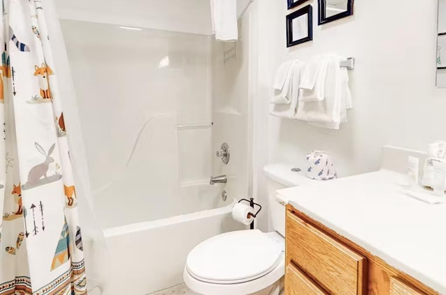 full bathroom with vanity, toilet, and shower / bath combo with shower curtain