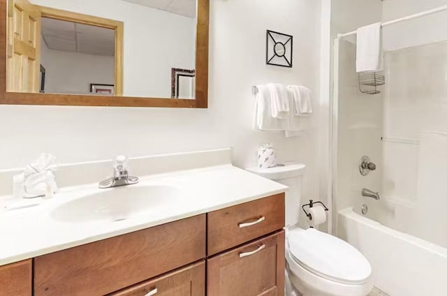 full bathroom featuring shower / bathing tub combination, vanity, and toilet