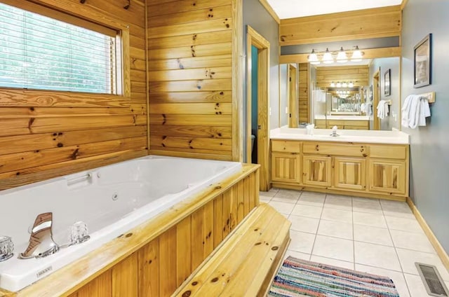 bathroom featuring a bath, vanity, tile patterned floors, and wooden walls