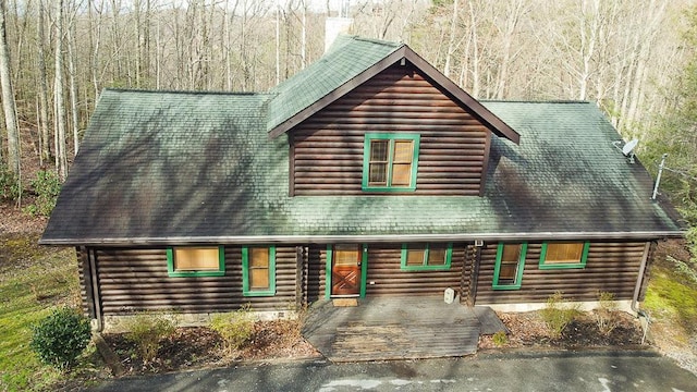 view of log cabin